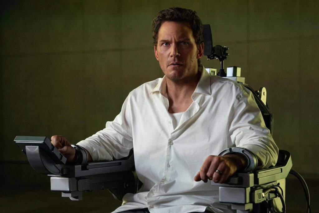 "Mercy" largely takes place in a single room, with Chris Pratt's character strapped to a chair opposite the AI judge. - The Latino Slant