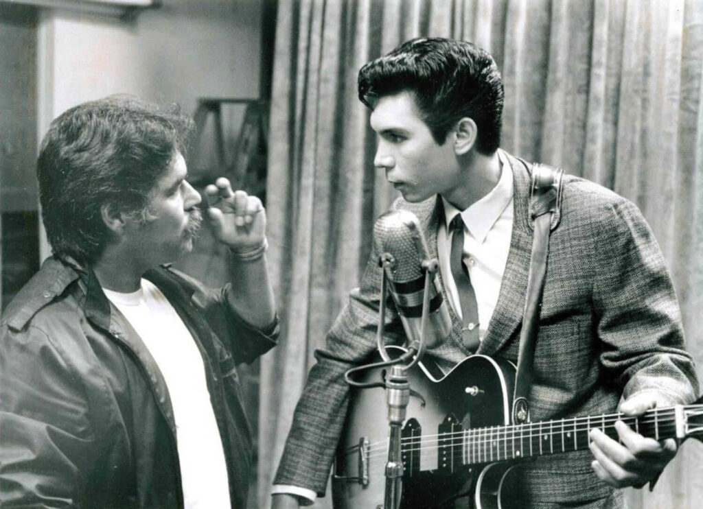 Luis Valdez and Lou Diamond Phillips on the set of "La Bamba." - The Latino Slant