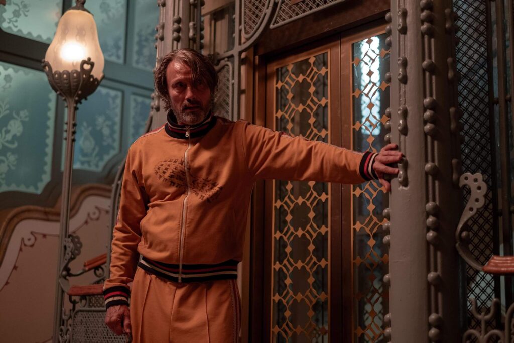 Mads Mikkelsen’s performance as "Intriguing Neighbor" anchors the film. - The Latino Slant
