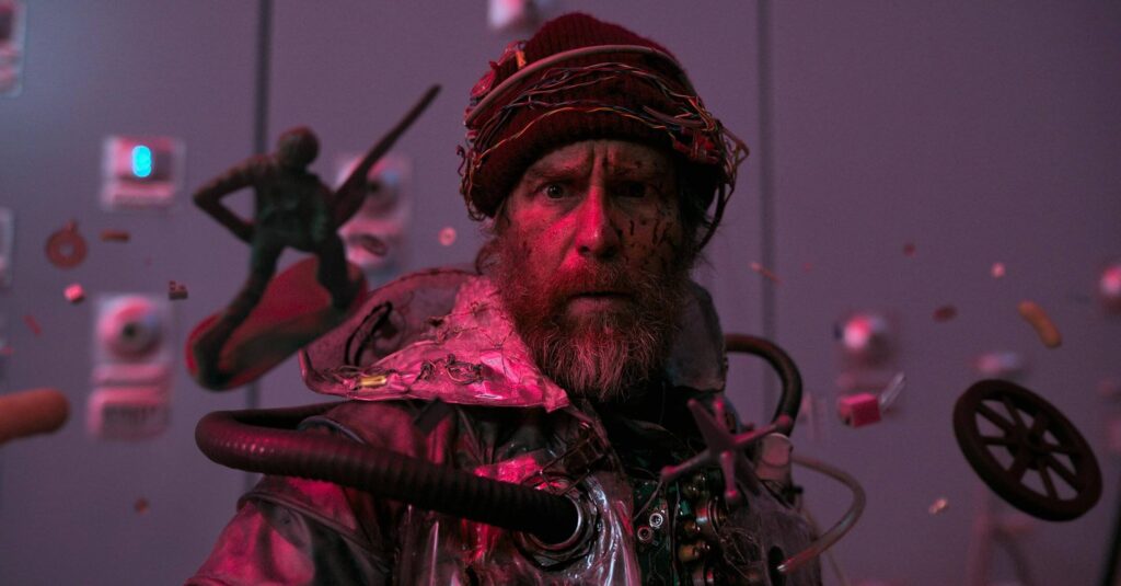 Sam Rockwell stars as a disheveled, seemingly unhinged messenger from the future in "Good Luck Have Fun Don't Die." - The Latino Slant