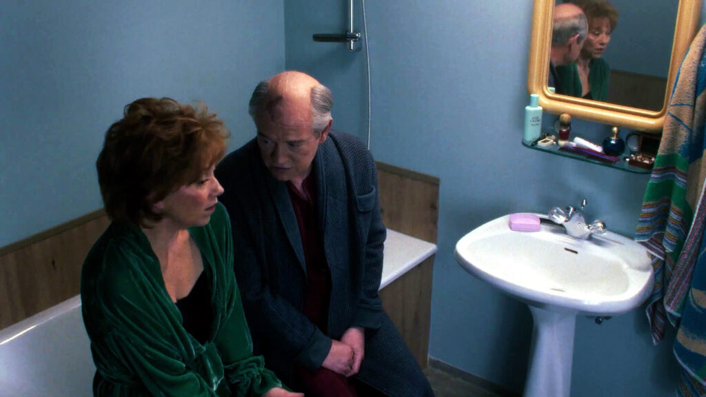 Gorbachev sharing a tender moment with his wife; the film does not portray him as a cartoon villain, which was a smart choice. - The Latino Slant