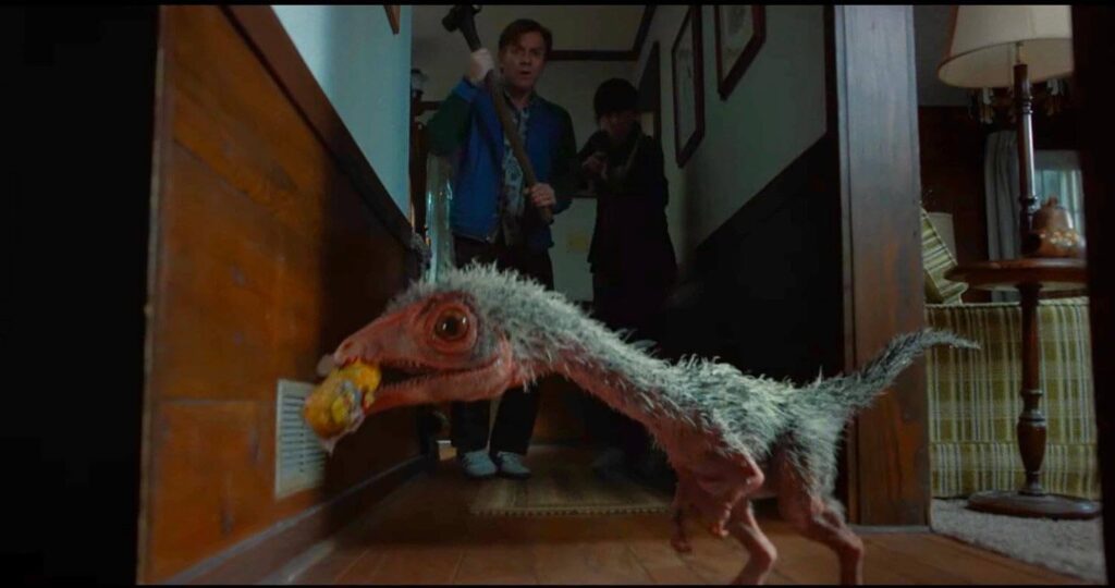 Greg and Denise come face-to-face with one of the film's prehistoric predators. - The Latino Slant