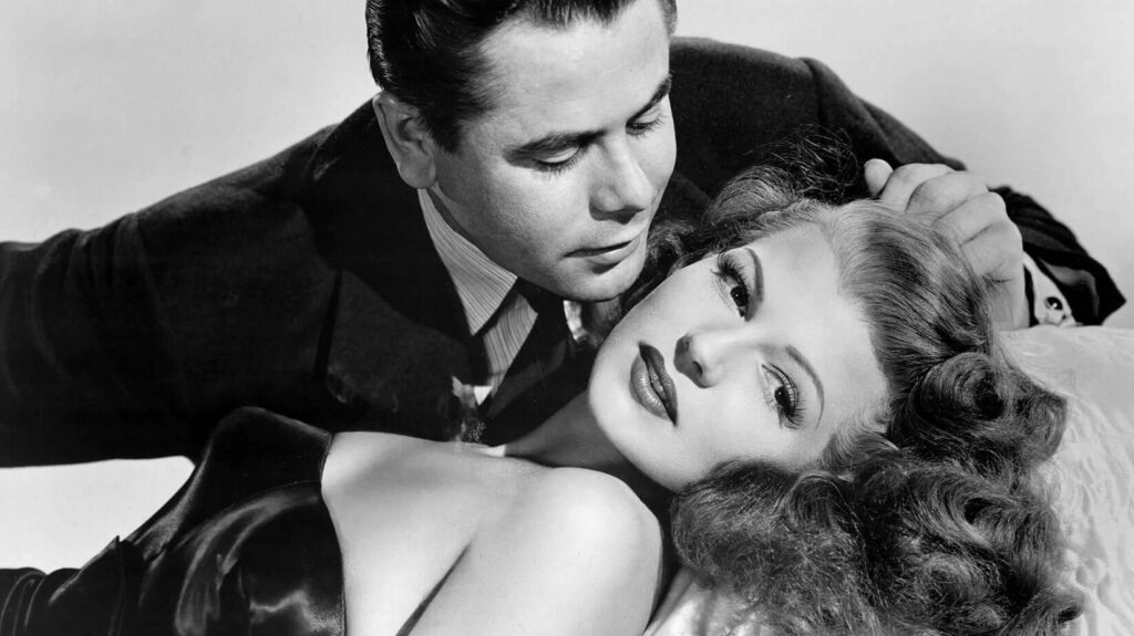 Glenn Ford cradles Rita in a romantic embrace in "Gilda" (1946). - The Latino Slant