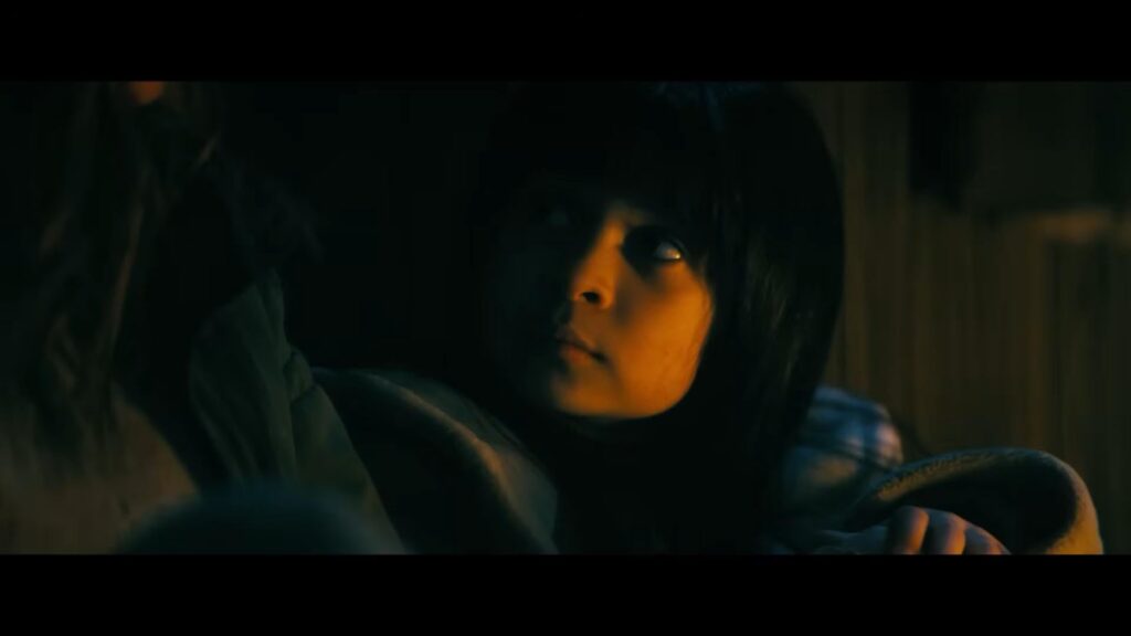 Celeste's daughter in a moment of quiet dread in "Onslaught." - The Latino Slant