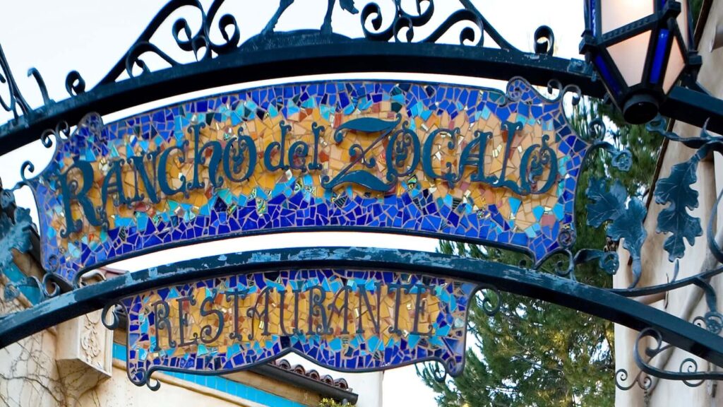 The mosaic-tiled entrance sign at Rancho del Zócalo Restaurante in Disneyland’s Frontierland. - The Latino Slant