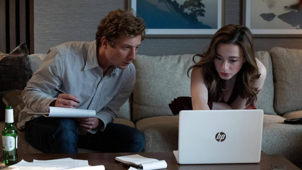 Jeremy Allen White and Mikey Madison as Jeff Horwitz and Frances Haugen review documents in "The Social Reckoning." - The Latino Slant