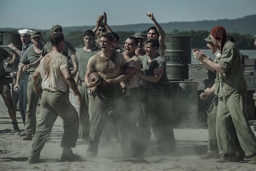 Marines erupt in celebration during the game in “The Mosquito Bowl.” - The Latino Slant