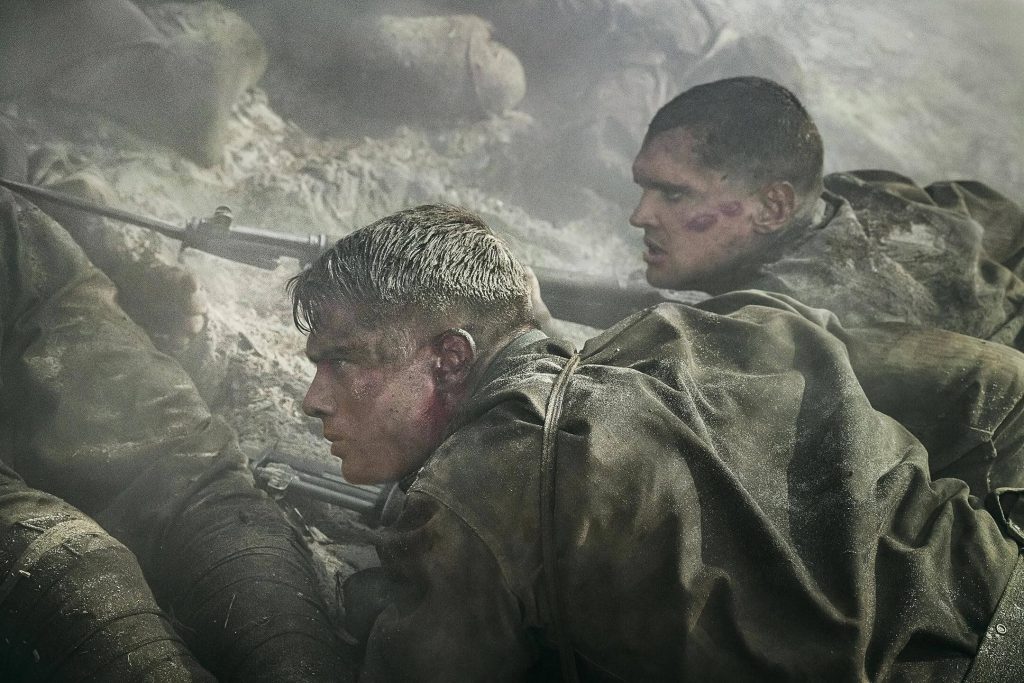 Tony and John hunker down in a smoke-filled trench in “The Mosquito Bowl.” - The Latino Slant