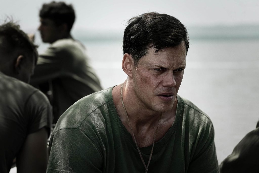 Bill Skarsgård as Bob Bauman braces for what lies ahead in “The Mosquito Bowl.” - The Latino Slant