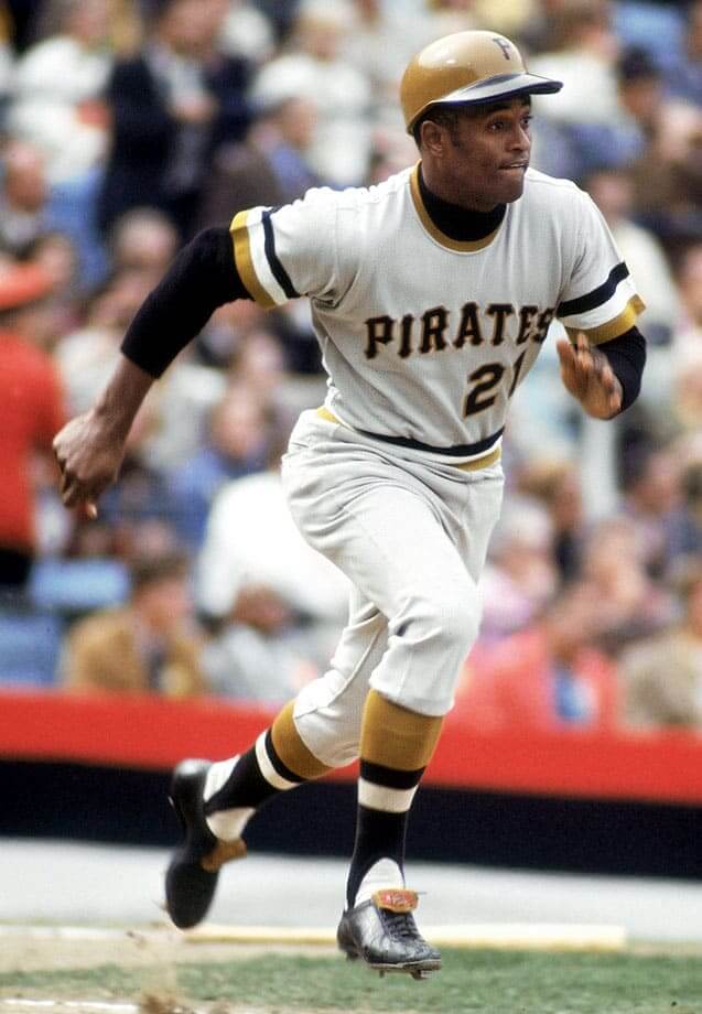 Clemente sprints down the baseline in the Pirates’ 1970s uniform. - The Latino Slant